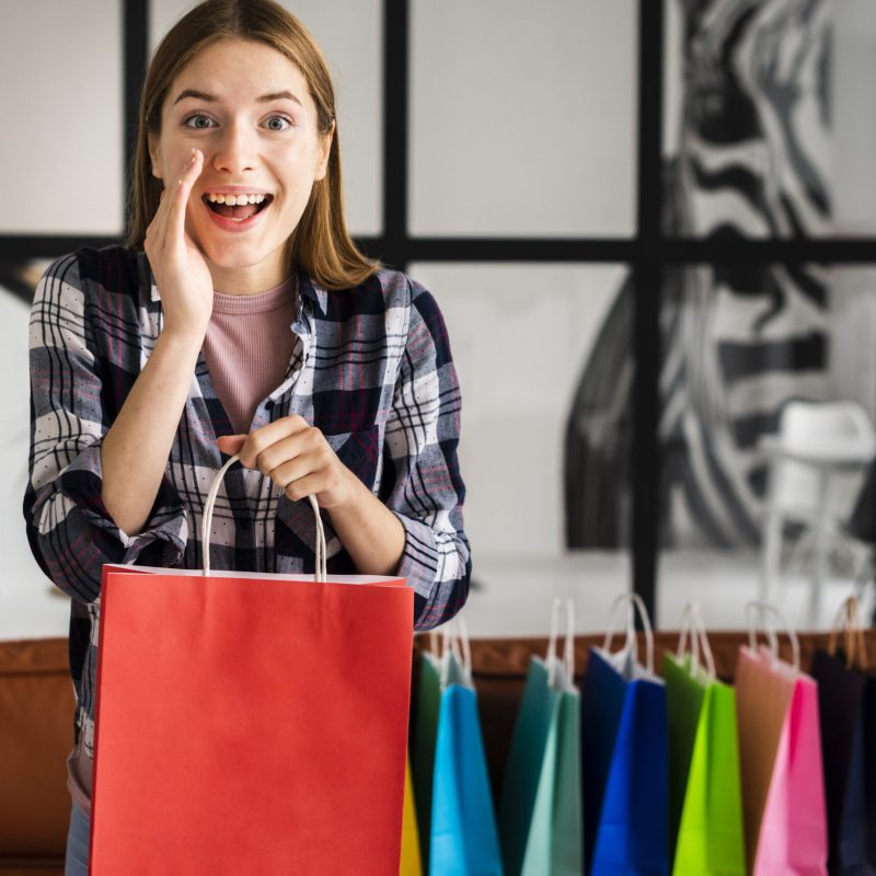 woman-telling-secret-holding-paper-bag